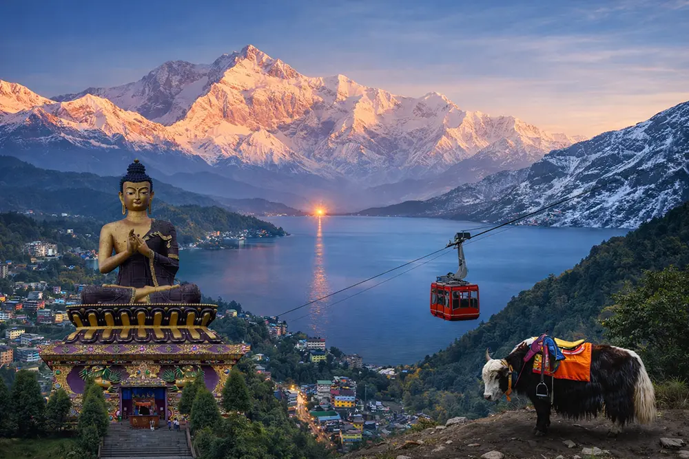 Himalayan blended view of Sikkim, Darjeeling, with a giant Buddha statue, a ropeway and the snow-covered Kanchenjunga range