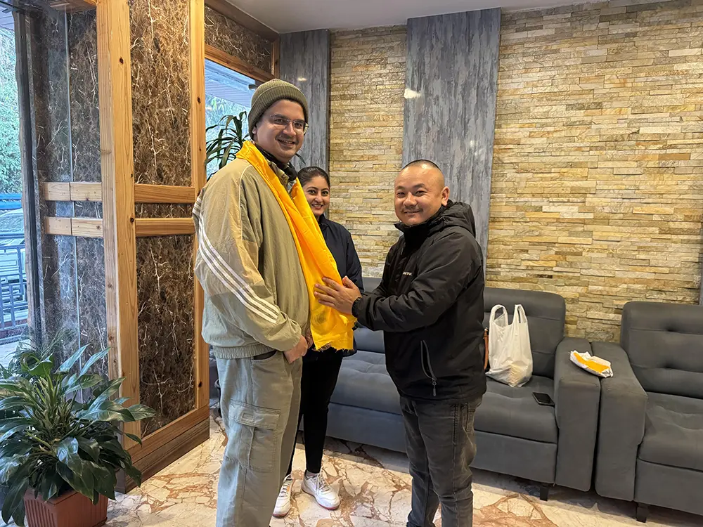 Jiwan Subba of Jeepa Travel Sikkim welcoming guests with traditional khada in Gangtok