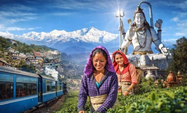 Women picking tea leaves in a Darjeeling tea garden with the iconic blue Toy Train, snow-capped Kanchenjunga range, colourful hillside town, and the towering Shiva statue at Namchi's Char Dham in the background — Sikkim and Darjeeling tour
