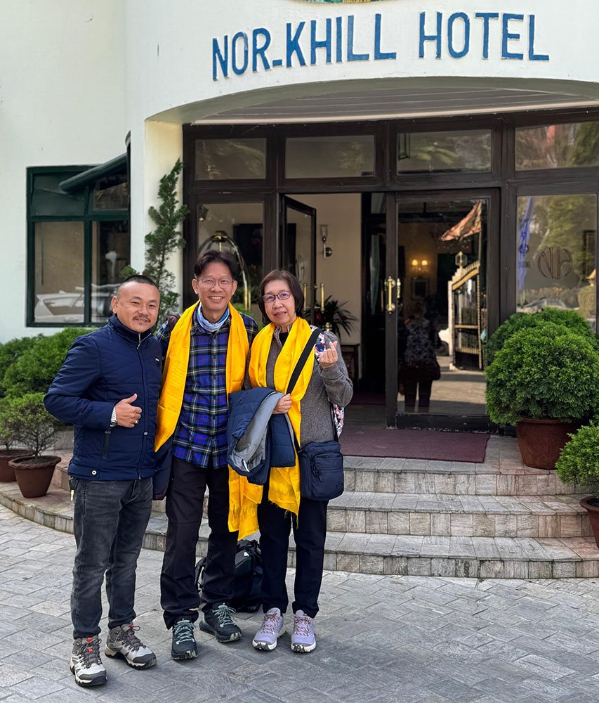 Jeepa Travel Sikkim host with happy guests outside Nor-Khill Hotel in Gangtok, Sikkim